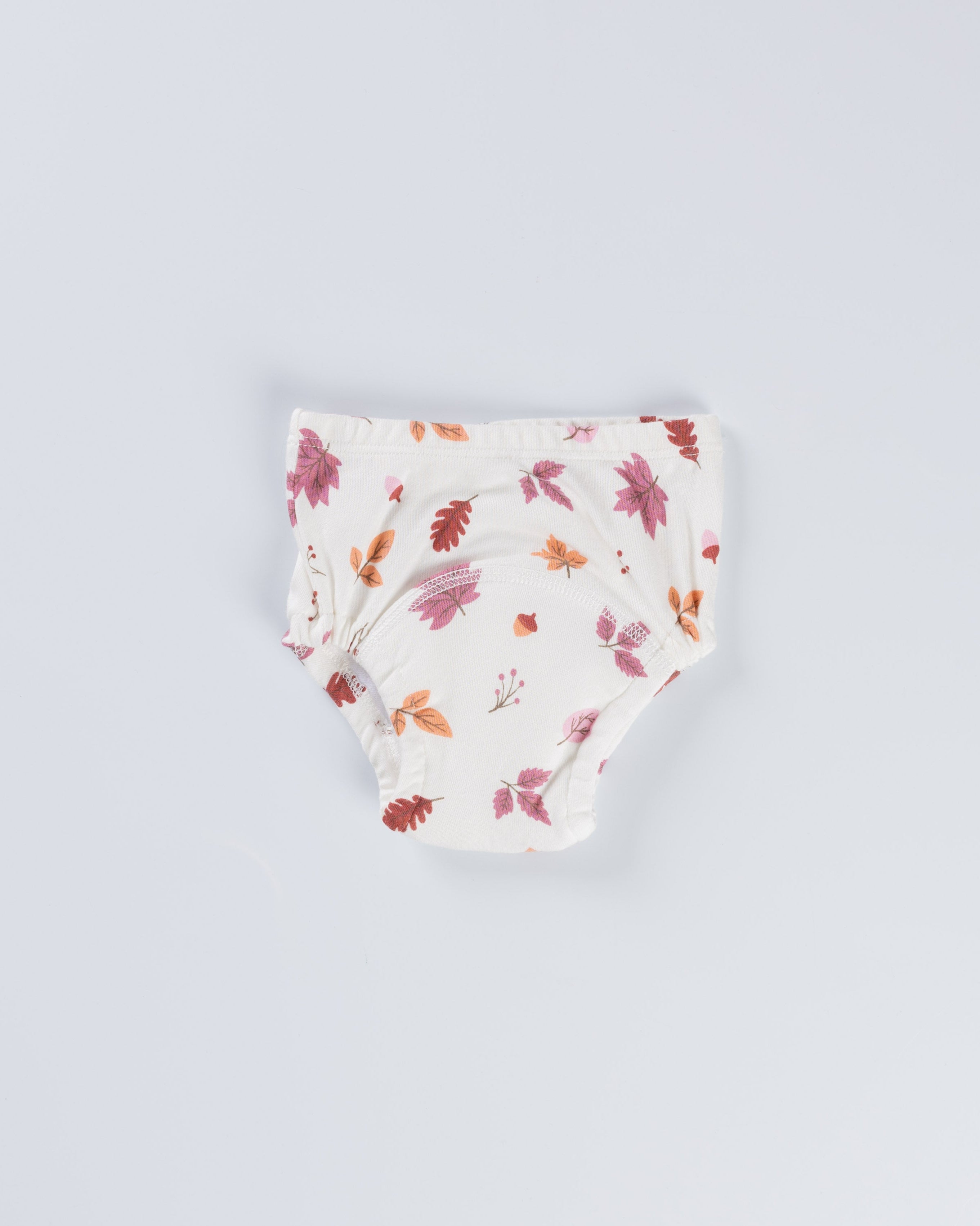 Floral-patterned baby bloomers on a light gray background
