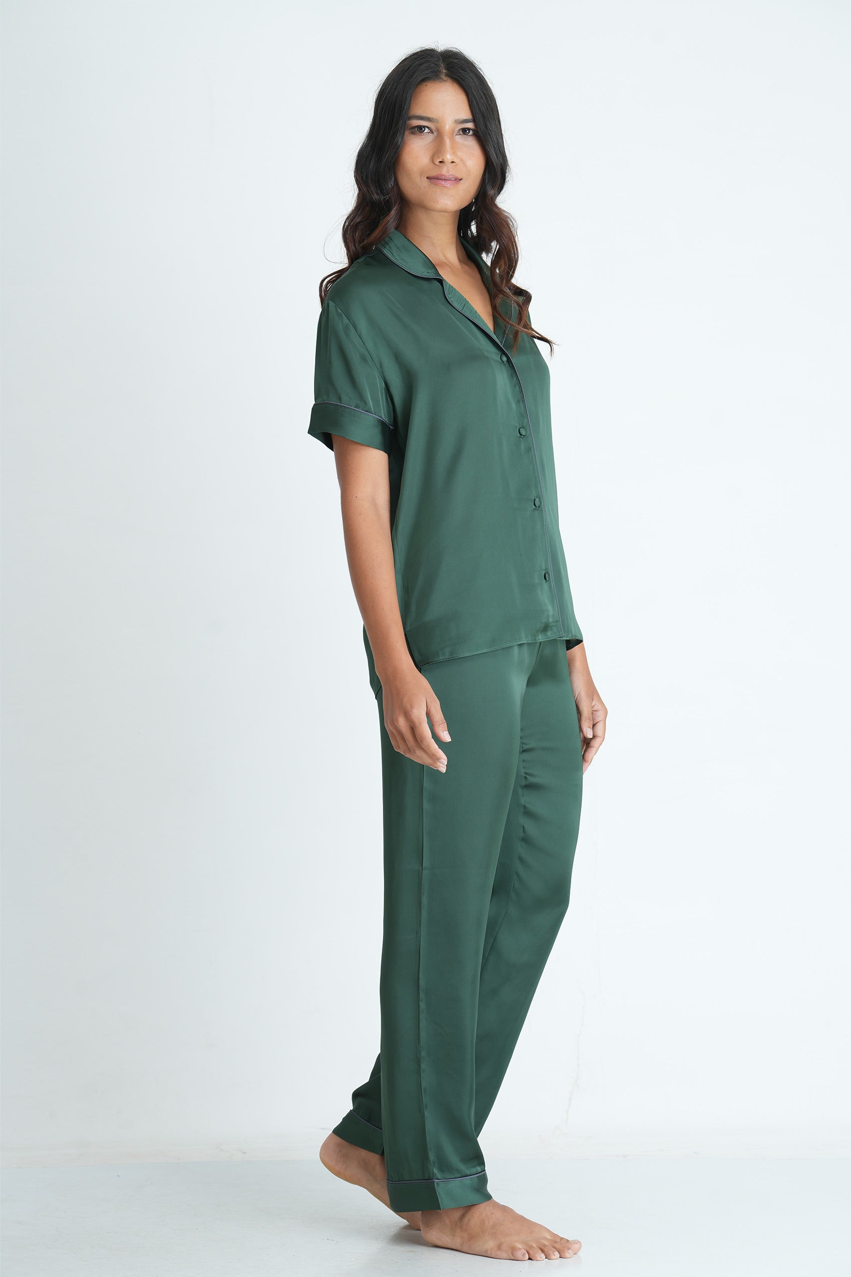 Our classic Pajama shirt & pants in Satin. Shirt with a Button down placket & contrast cording, short sleeves. Pants with an elasticized waistband, straight legs with a contrast pipping.